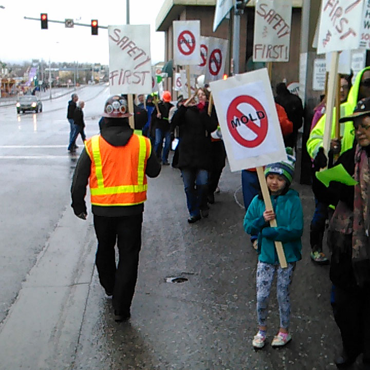 Workers and supporters rally at the Hilton Anchorage on March 6. The union has contracted with a building inspector in an effort to better understand the causes of mold growth reported at the hotel in 2014 and to prevent its recurrence.